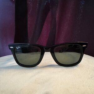 Classic black Rayban wayfarer sunglasses with silver hardware.